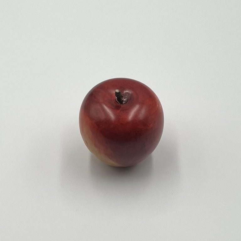 Hand painted wooden red apple with small brown stems.