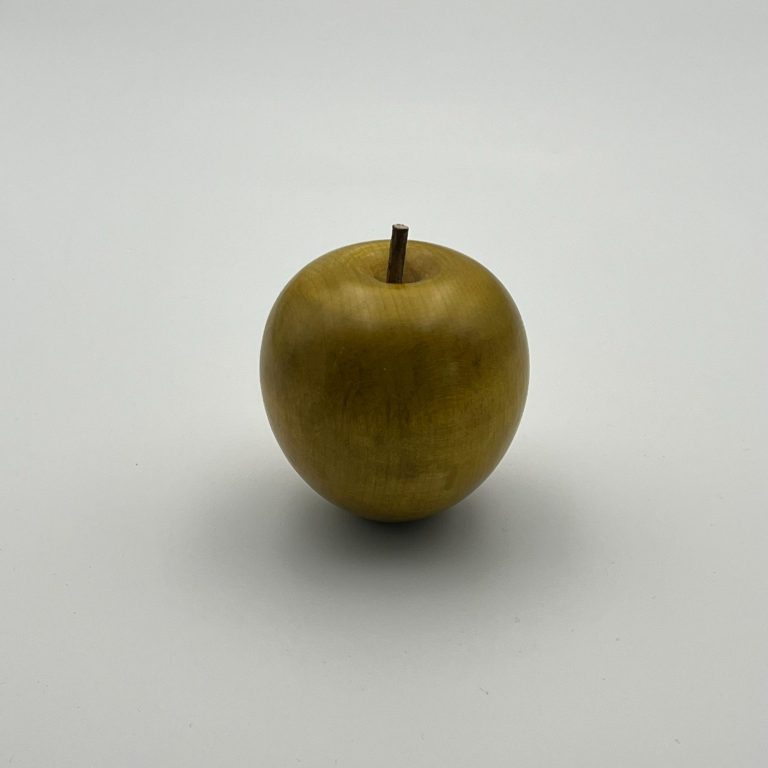 Hand painted wooden yellow apple with small brown stems.