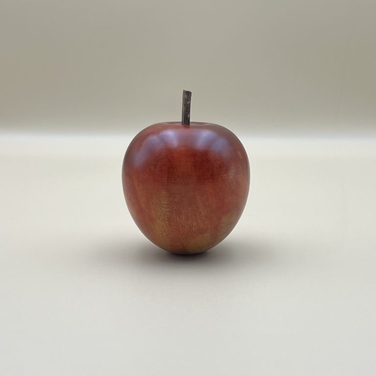 Hand Painted Red Wooden Apple Hand painted wooden red apple with small brown stems.